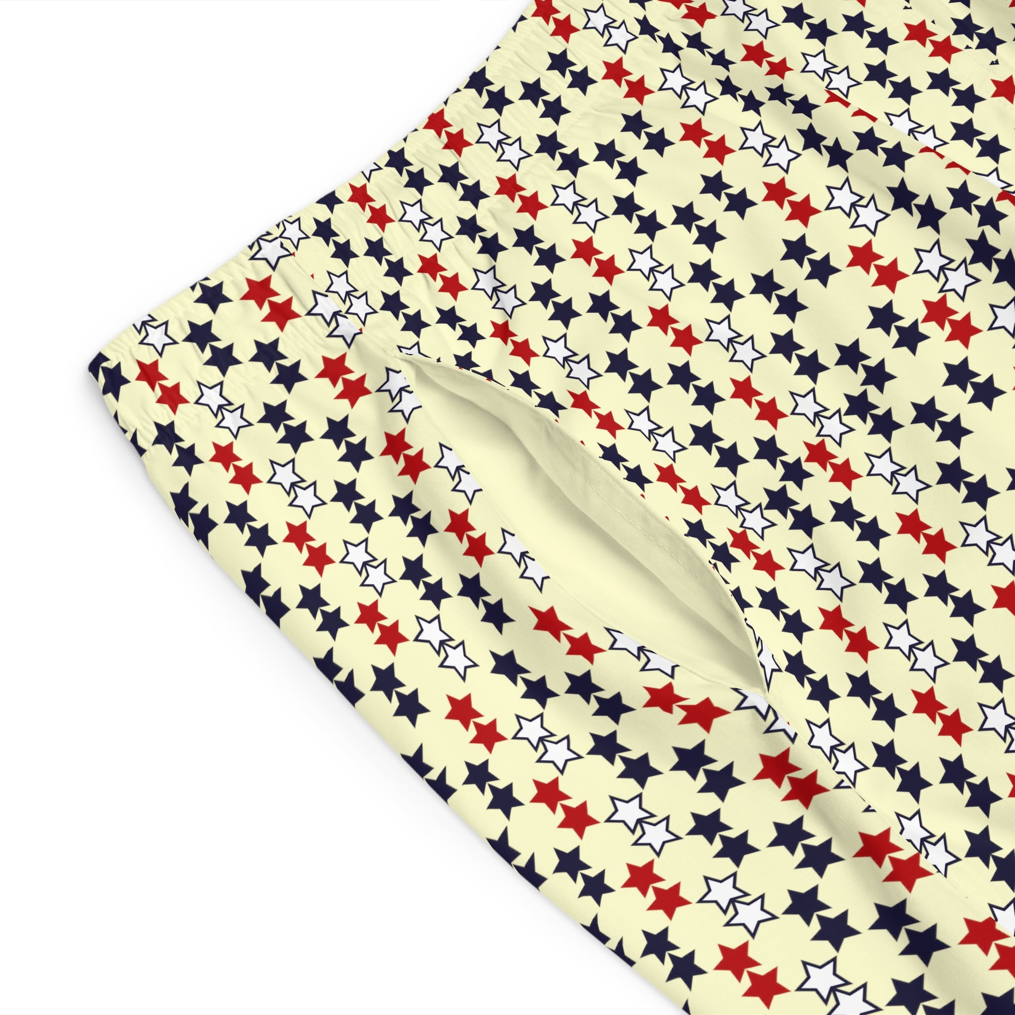 cream star print board shorts for men