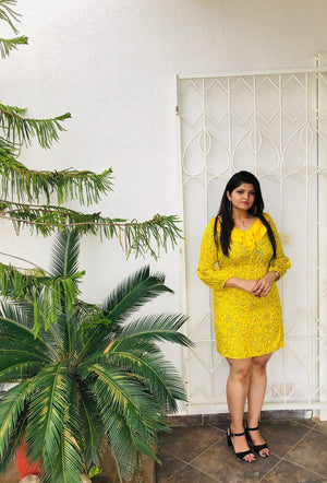 Yellow screen printed dress with neck ruffles, elastic waist & pleated sleeves