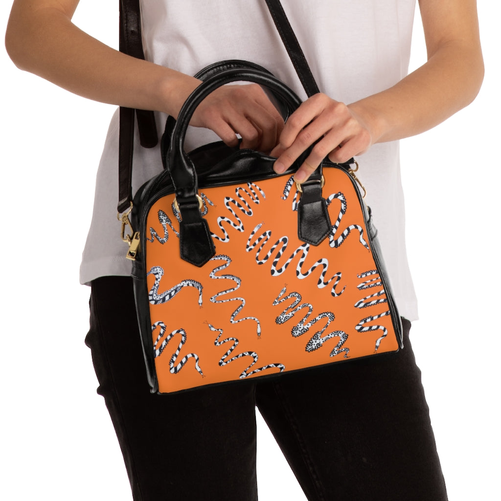 peach snake print handbag