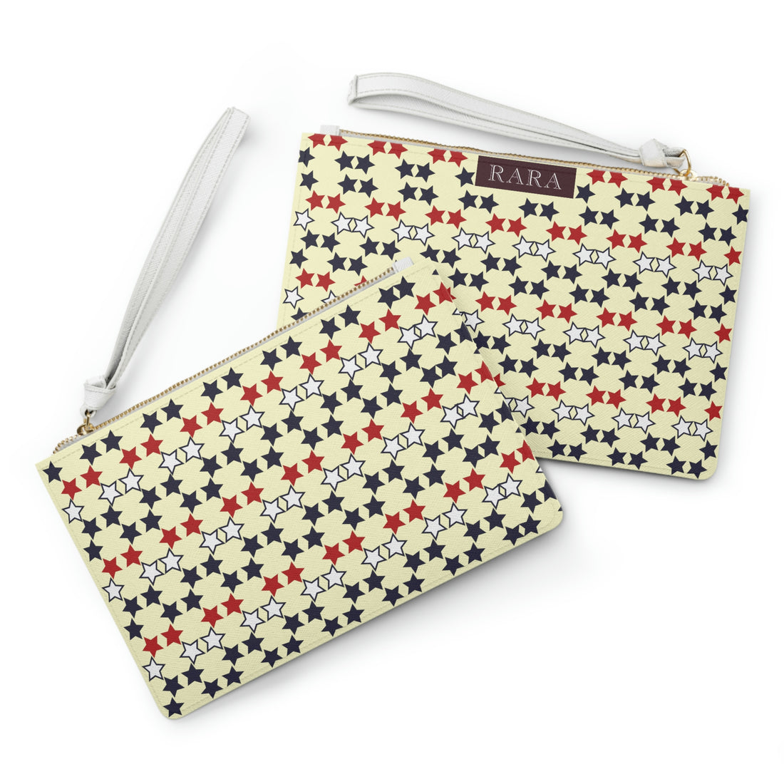 cream star print clutch bag