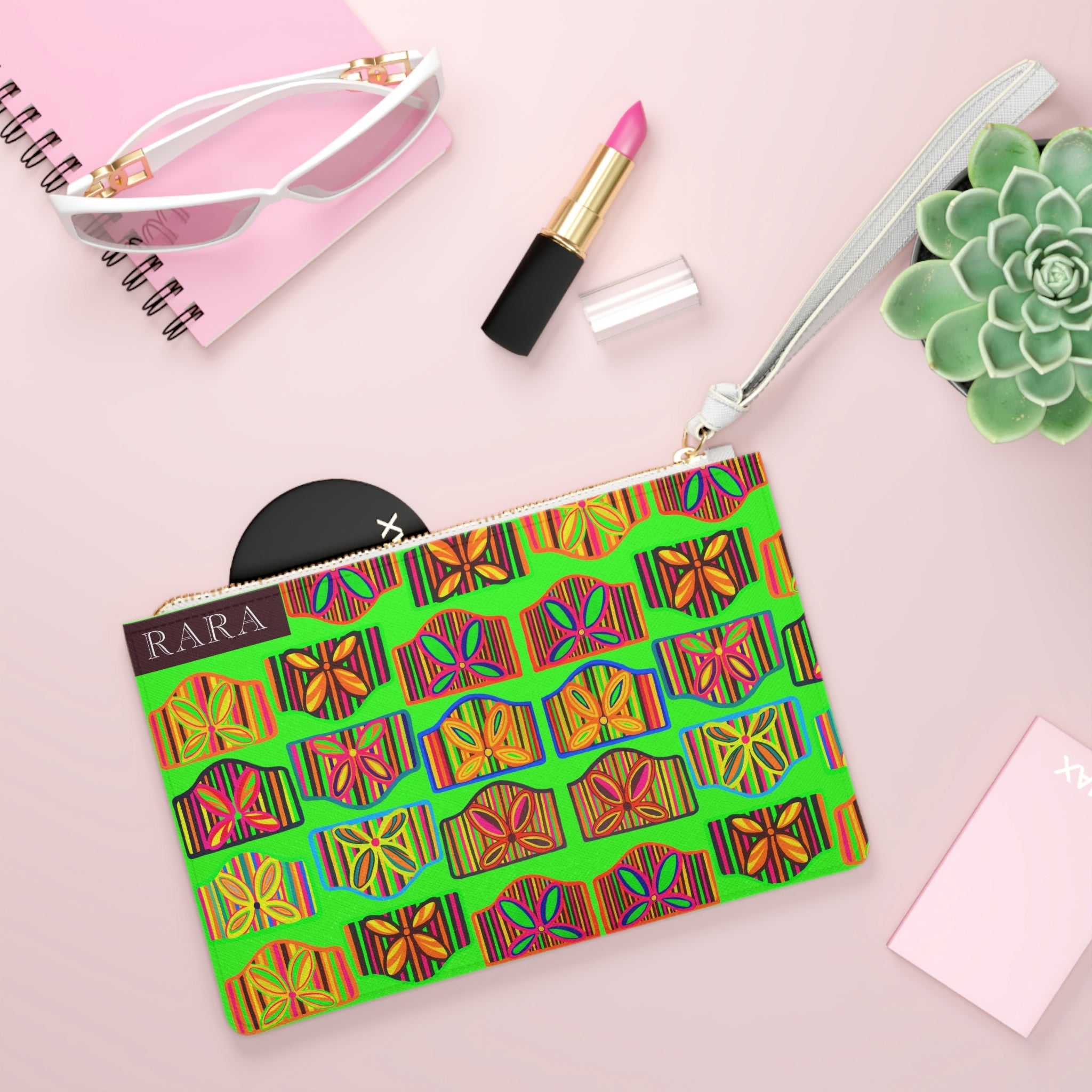 neon green art deco print clutch bag