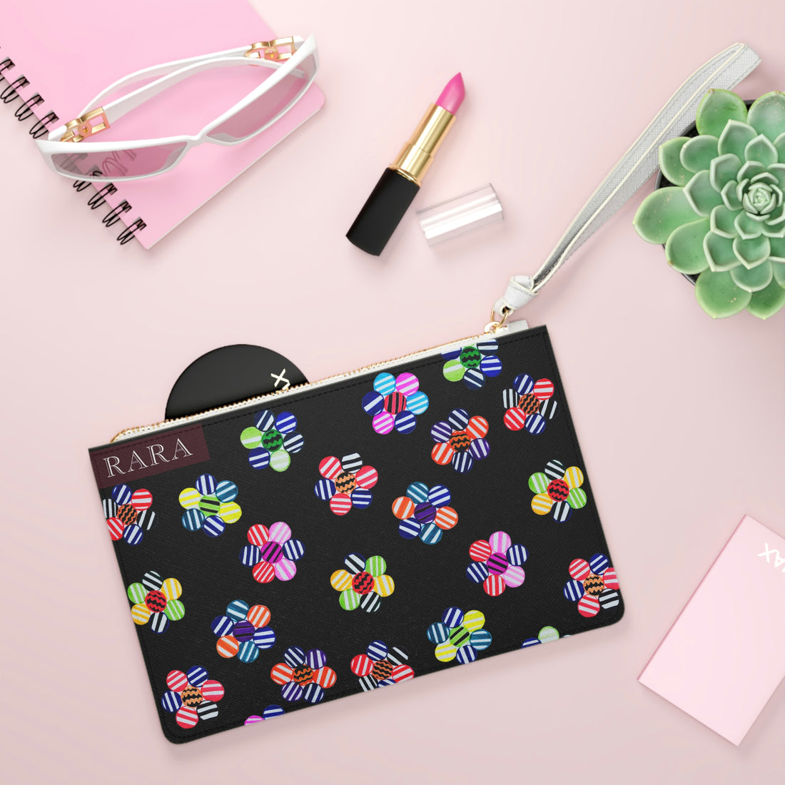 black geometric floral clutch bag