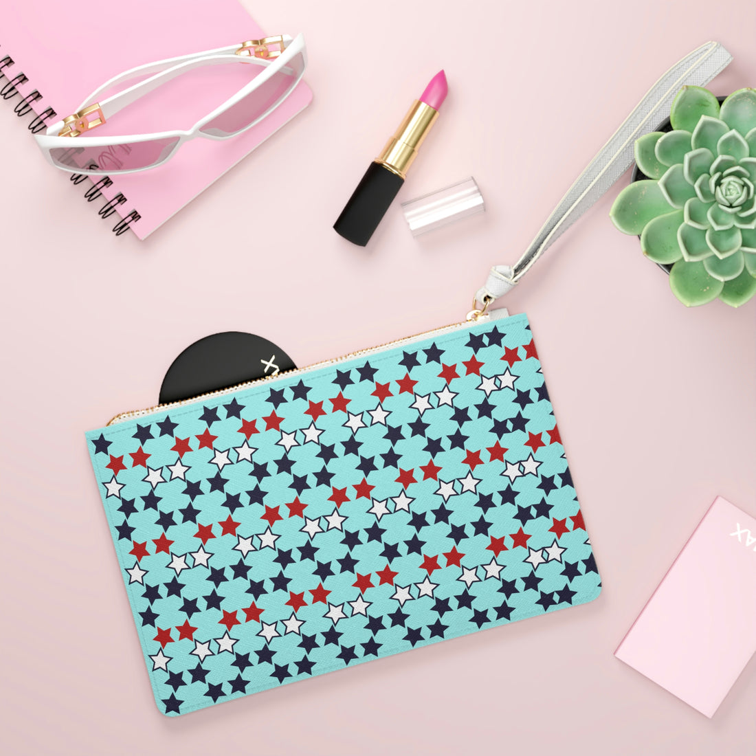 star print icy blue clutch bag