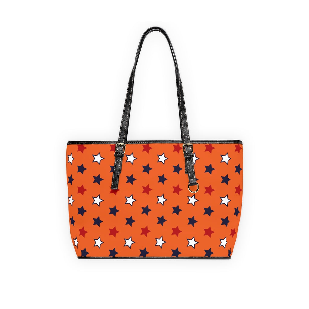 orange star print handbag