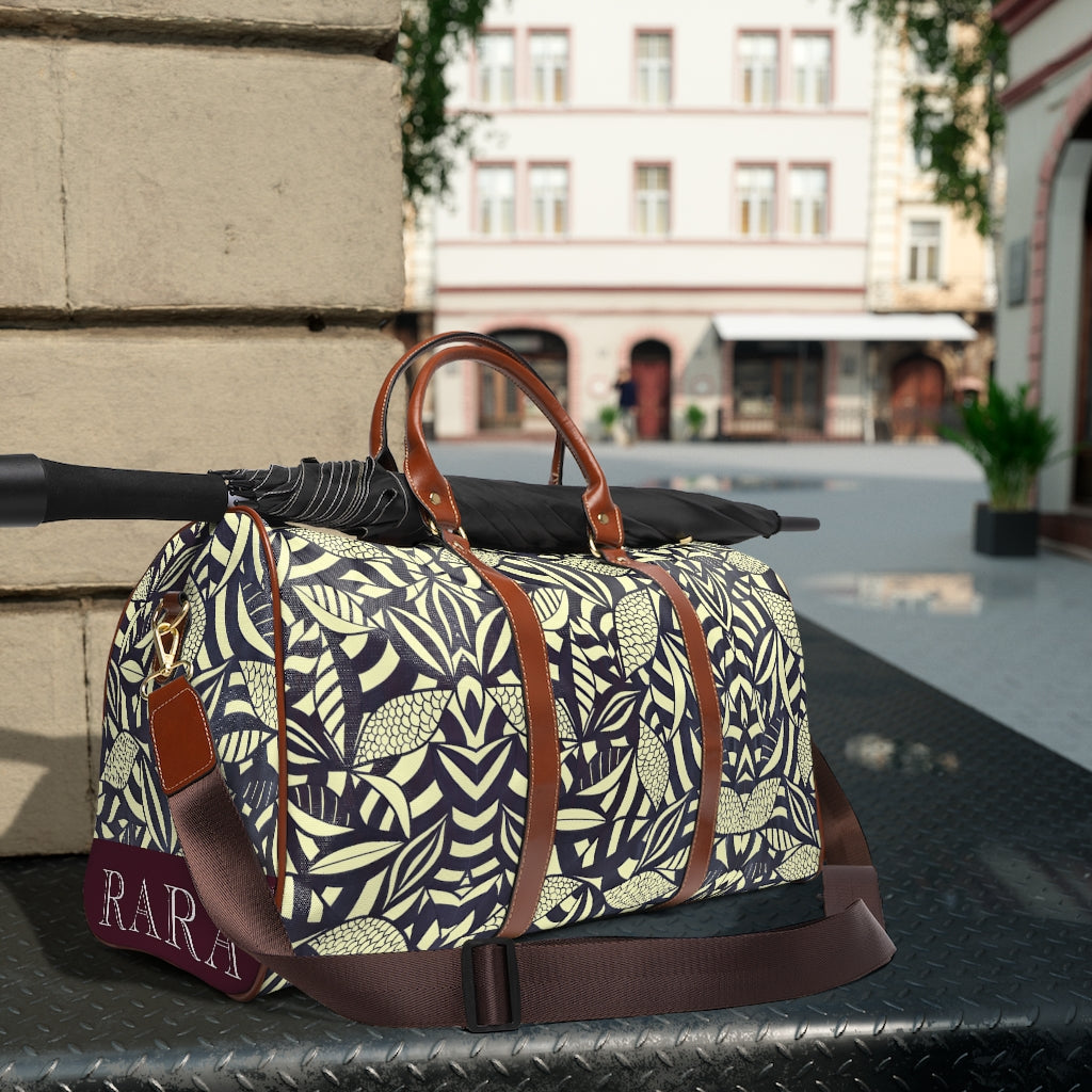 cream tropical print duffel bag