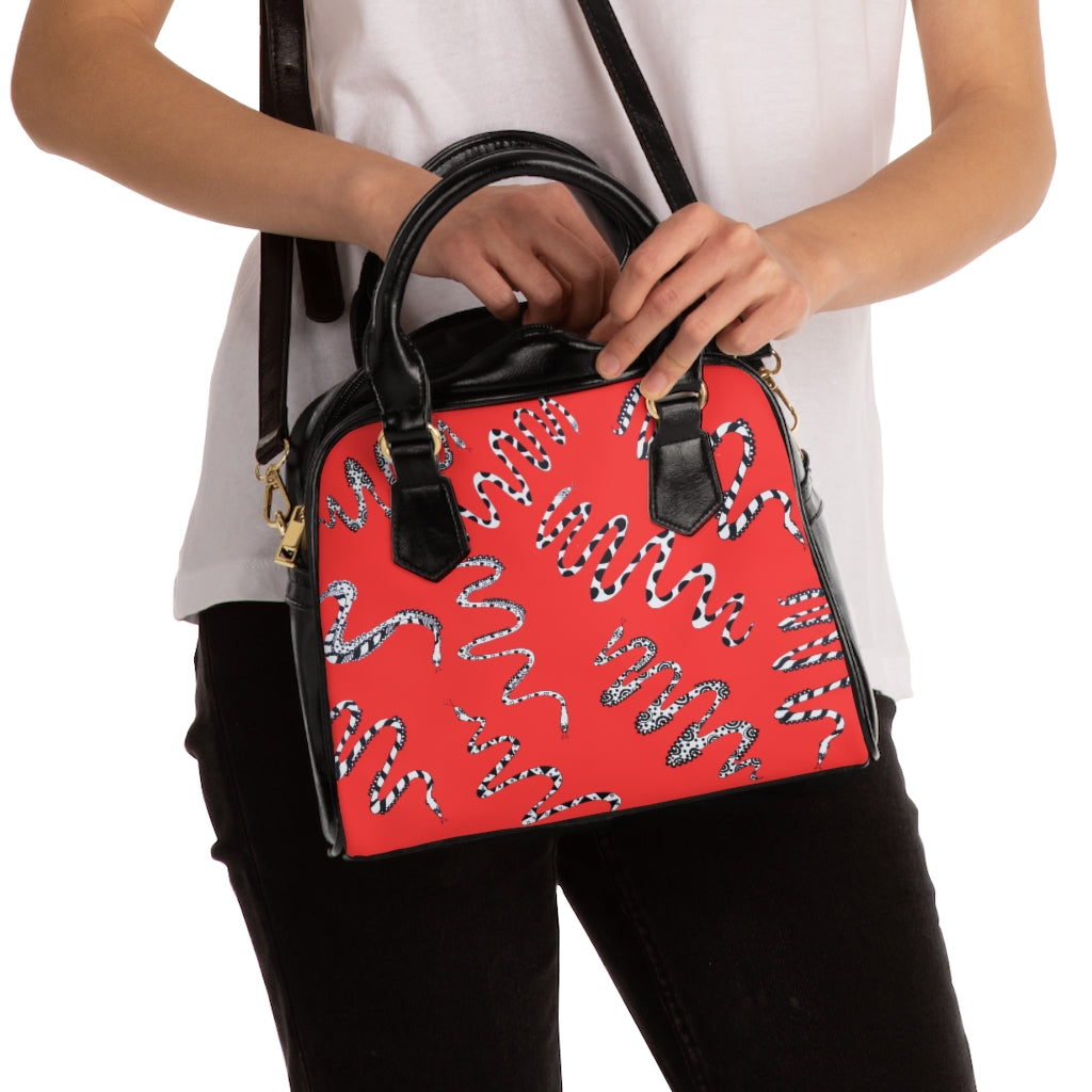 vermillion snake print handbag