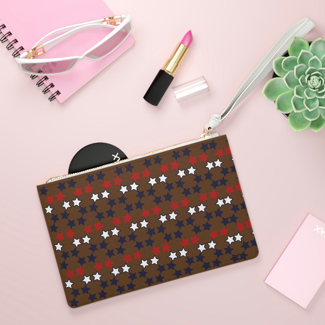 brown star print clutch bag 