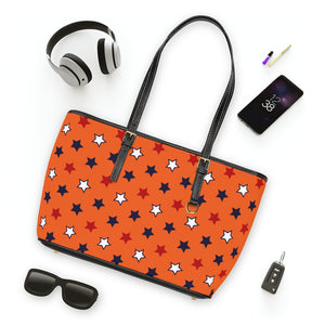 orange star print handbag