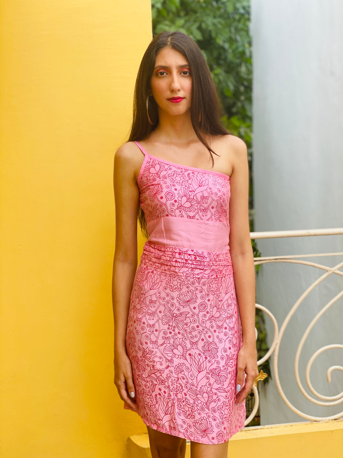 Blush pink one shoulder dress with waist pleating & red floral screen print